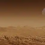 Anonieme roversporen op een rotsachtige krater op Mars onder een bleke hemel